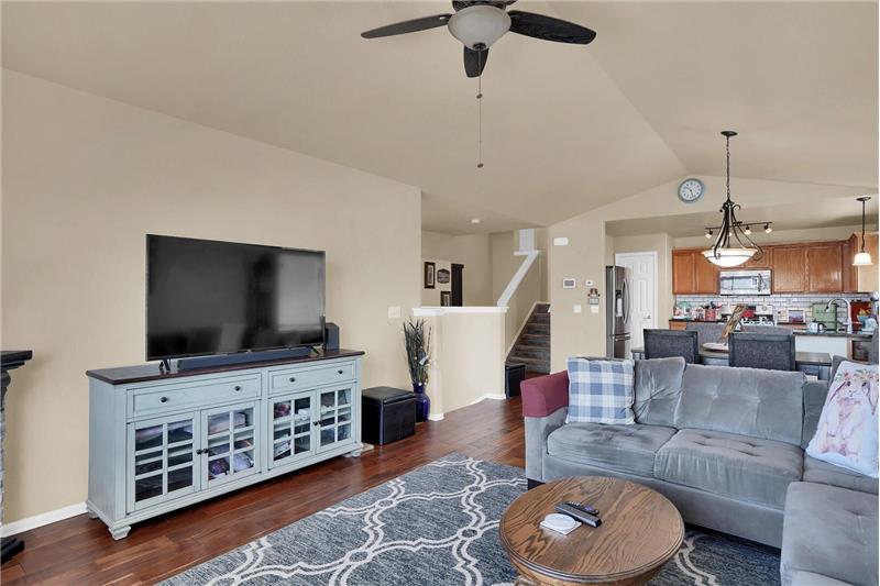 Open main floor with large living spaces, custom blinds, 6-panel doors, and brushed nickel hardware