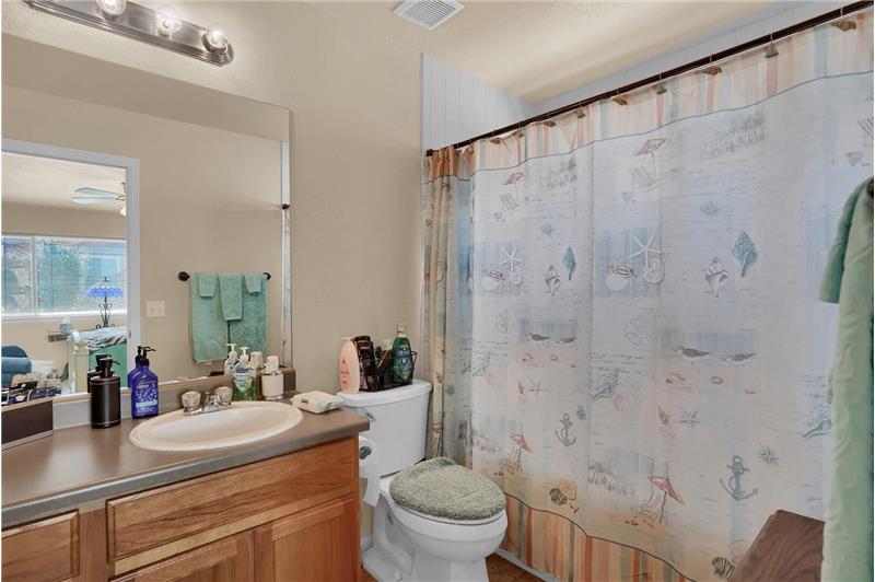 The Master Bathroom features a vanity and garden soaking tub/shower
