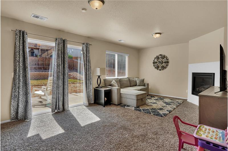 The lower-level Family Room has a slider out to the expanded patio