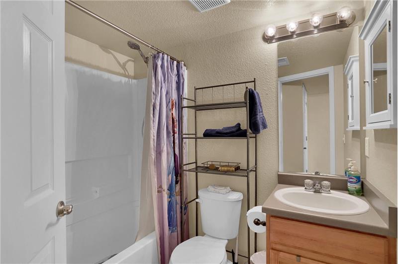 Basement Bathroom with vanity and tub/shower