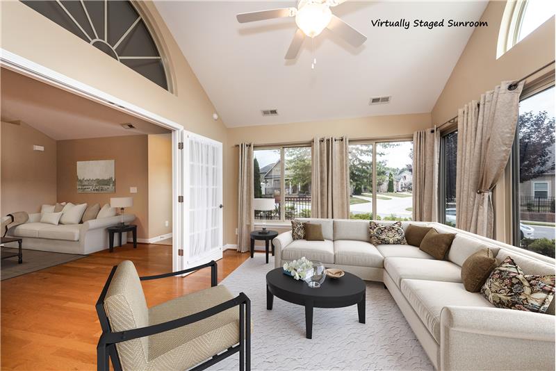 Virtually staged sun room.... open to living room; great flow when entertaining.