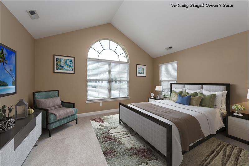 Virtually staged owner's suite... serene and spacious with room for king-size bed.