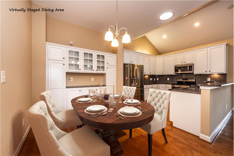 Virtually staged dining area... ideal for both daily dining and entertaining.