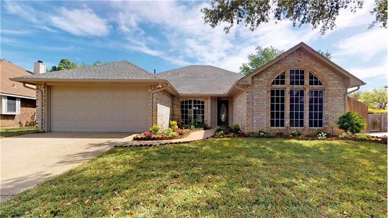 Beautifully remodeled home in central Flower Mound location with fresh sod and landscaping