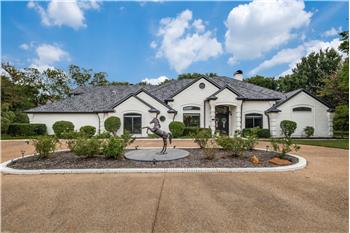 Front view with circle driveway.