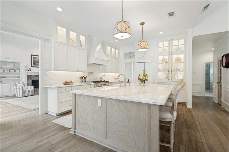 Kitchen with view into the formal living room and hall to the walk in pantry.