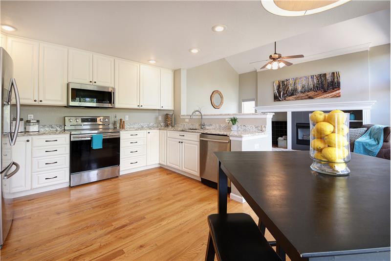 Spacious Eat-In Kitchen with Soft-Close Cabinets with Granite Countertops and Cabinet Pantry