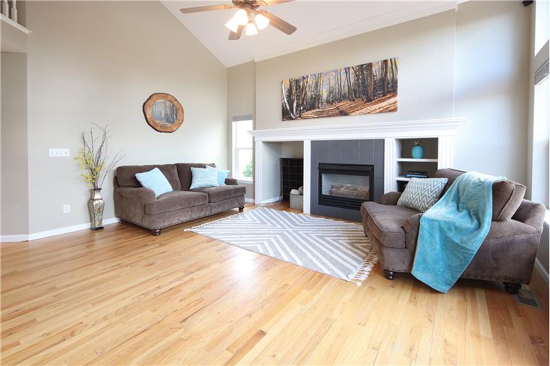 Bright, Walk-Out Family Room with Built-in Shelves and Gas-Log Fireplace