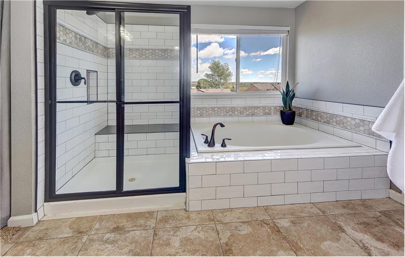 The Master Bathroom also provides a Window above the Soaking Tub and TIled Tub/Shower with Built-In Seat