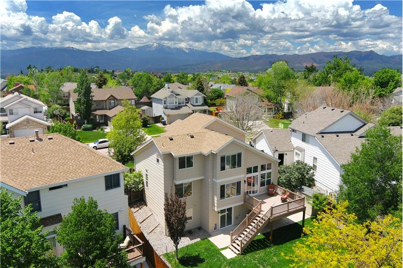 Aerial View of Rear of Home with Mountains in the Background