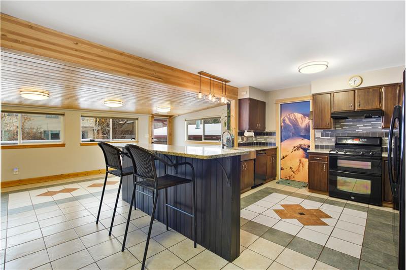 Large kitchen with dining peninsula