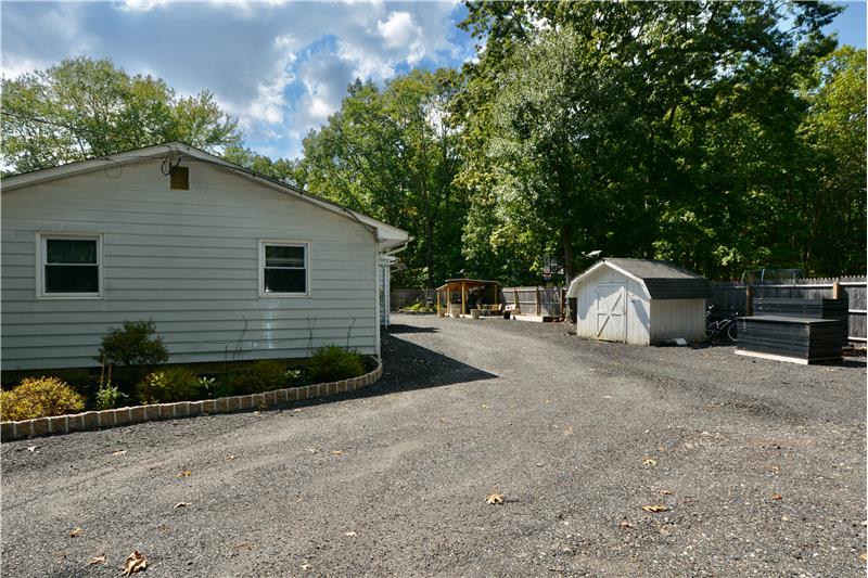 Exterior Side and storage shed