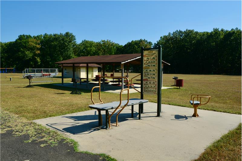 pavilion with picnic table and bbq's