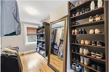 A walk-in closet with space to dress