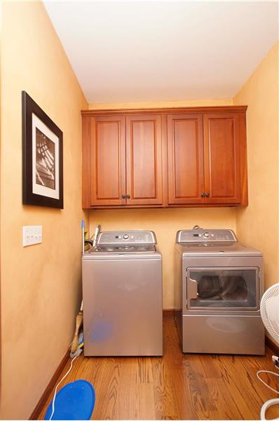 Main floor laundry with storage space
