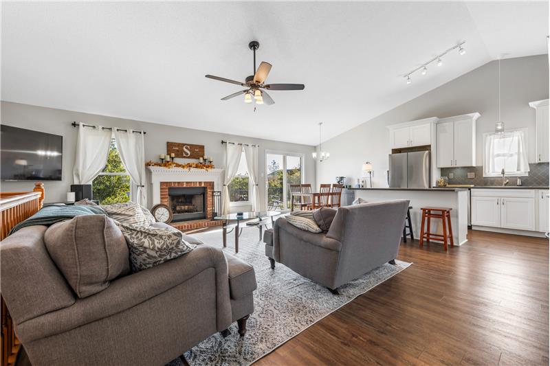 From Great room looking at the kitchen/dining area and door to the deck