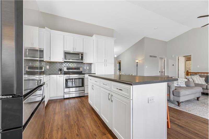 Kitchen with Stainless appliances, tile backsplash
