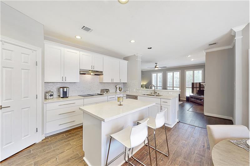The kitchen is light and bright and opens up to the family room.