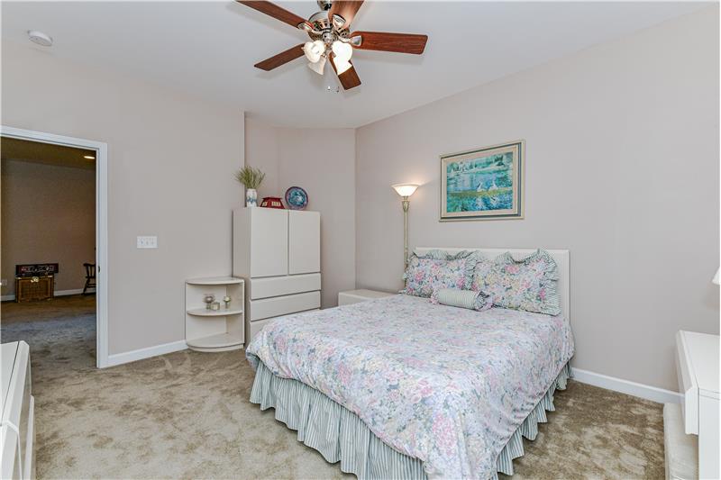 Private bedroom features a spacious walk-in closet... perfect for guests and visiting family.