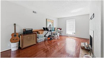 Large living room with wood burning fireplace