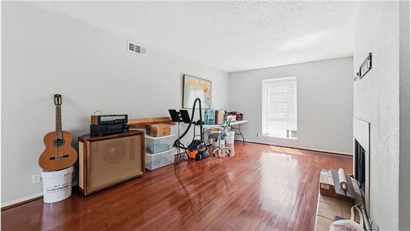Large living room with wood burning fireplace