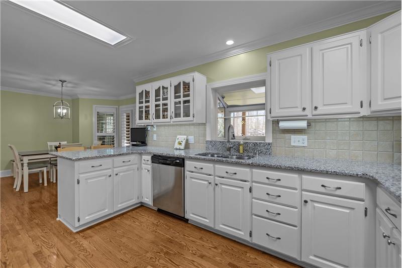 Spacious kitchen with lots of counter and cabinet space plus a peninsula ideal for casual seating.