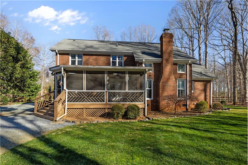 Back of home and screened porch.