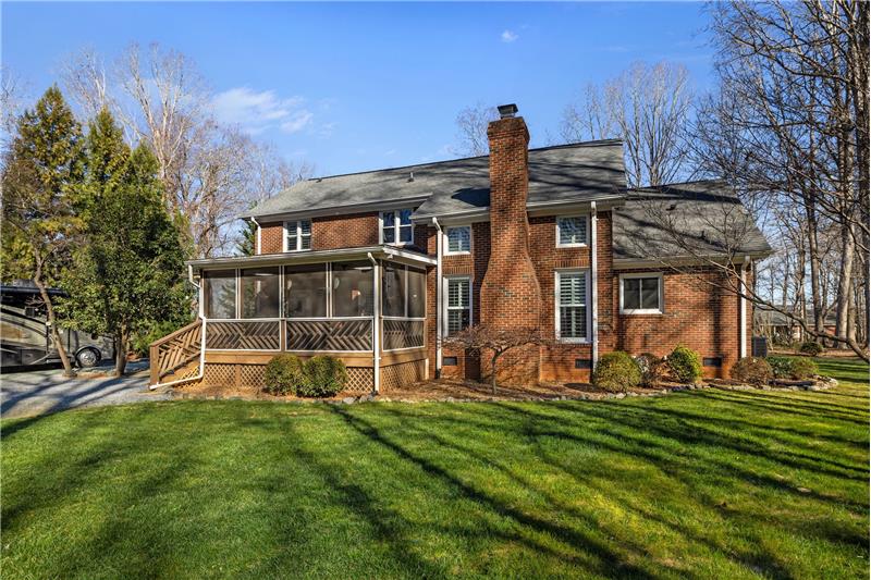 View of back of home and screened porch.