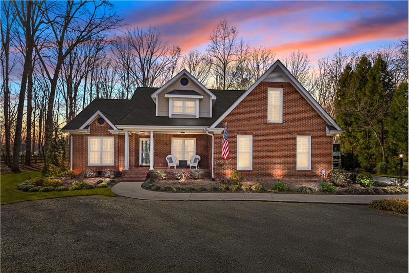 Classic architecture, professional landscaping and 
lighting, and a welcoming covered front porch. 