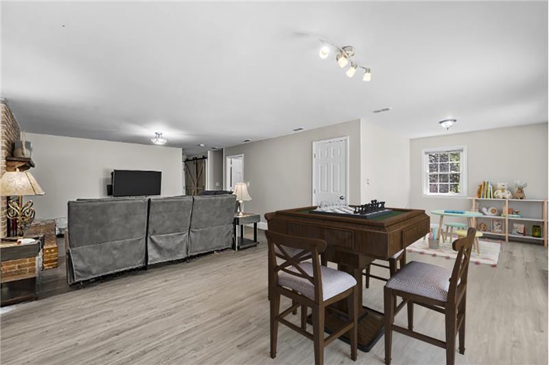 Family/entertainment room has tons of space for game tables