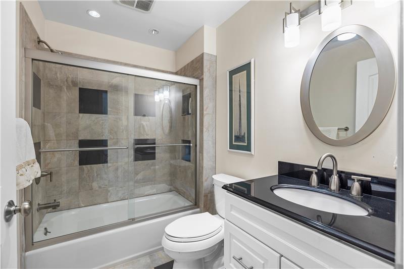 Full bathroom shared by secondary bedrooms.