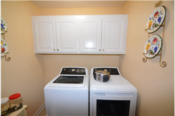 Laundry room with cabinets