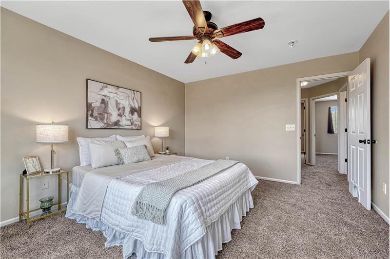Spacious Primary bedroom with adjoining full bath and walk-in closet