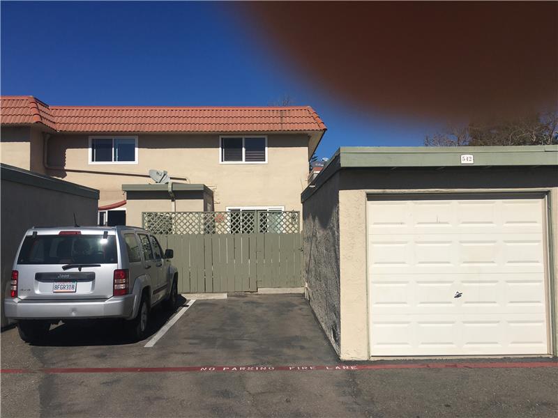 1 car garage and 1 uncovered parking space