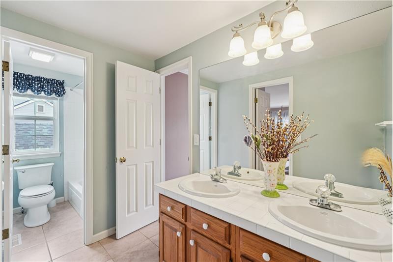 Jack & Jill bathroom with separate room for toilet and tub