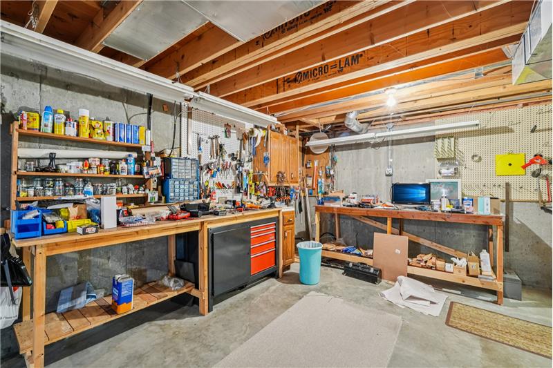 Workshop at entrance to unfinished basement