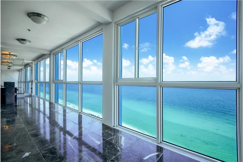 Balcony enclosed with impact glass and amazing ocean views.