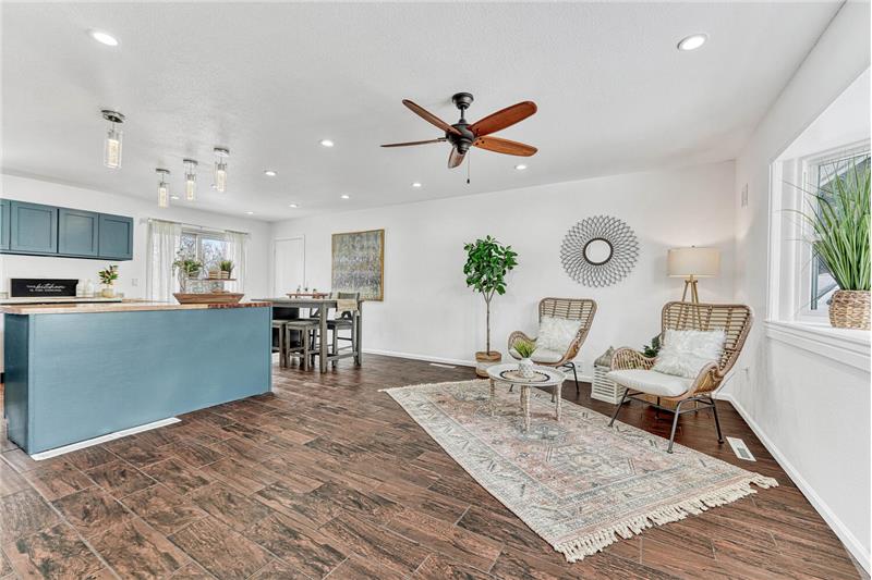 The Living Room flows into the Dining Area and Kitchen