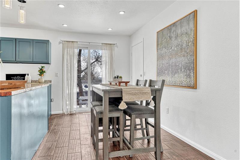 The Dining Area has a slider to the backyard