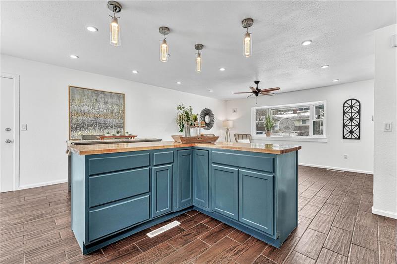 Kitchen Island with new butcher block countertop overlooking the Dining Area and Living Room