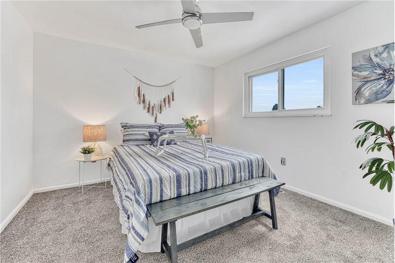 Upper Level Primary Bedroom with New Carpet and Lighted Ceiling Fan