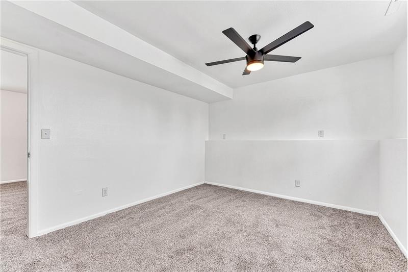 Lower Level Bedroom #4 with Lighted Ceiling Fan and Neutral Carpet