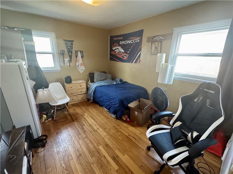 2nd bedroom with hardwood floor, new windows