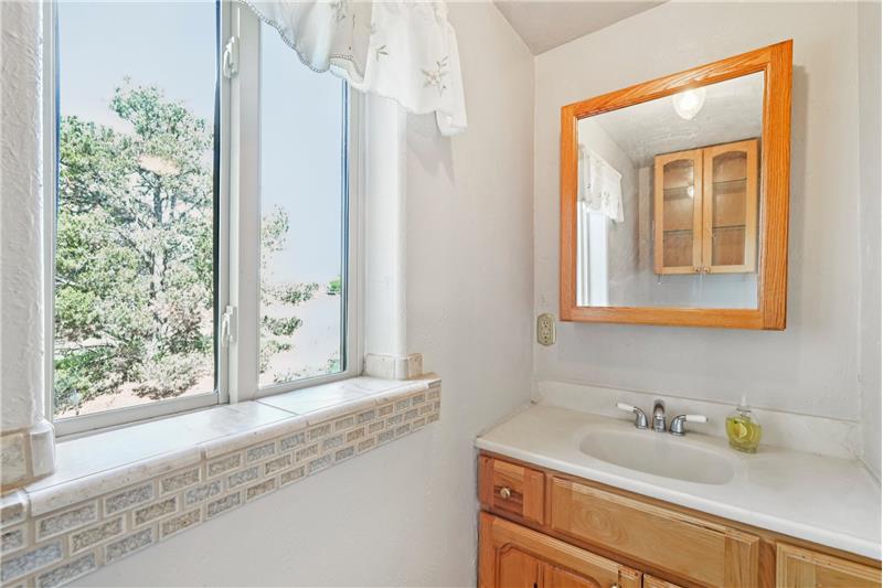 Half bath adjacent to laundry room