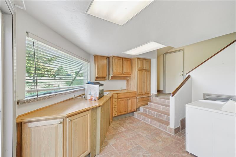 Laundry room. Stairs lead to garage and 2nd floor