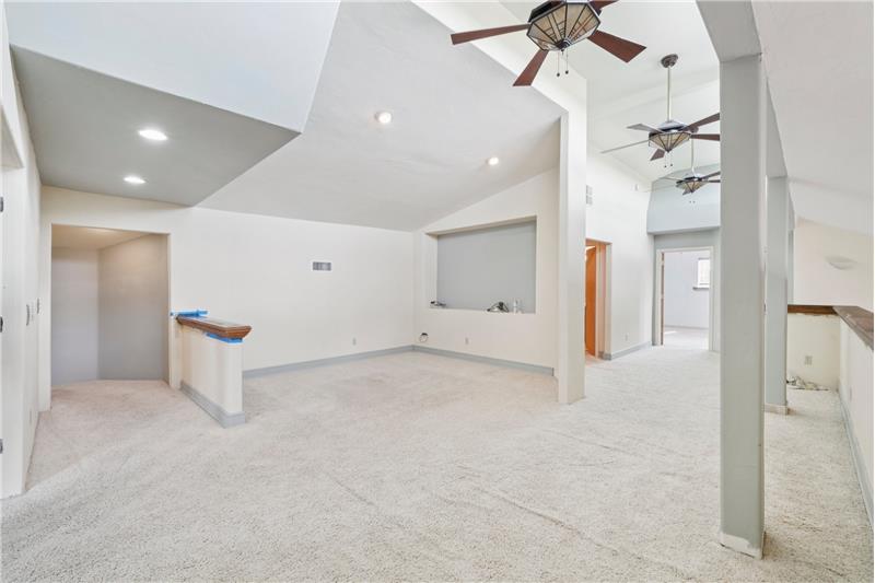 Loft showing large nook for home theater