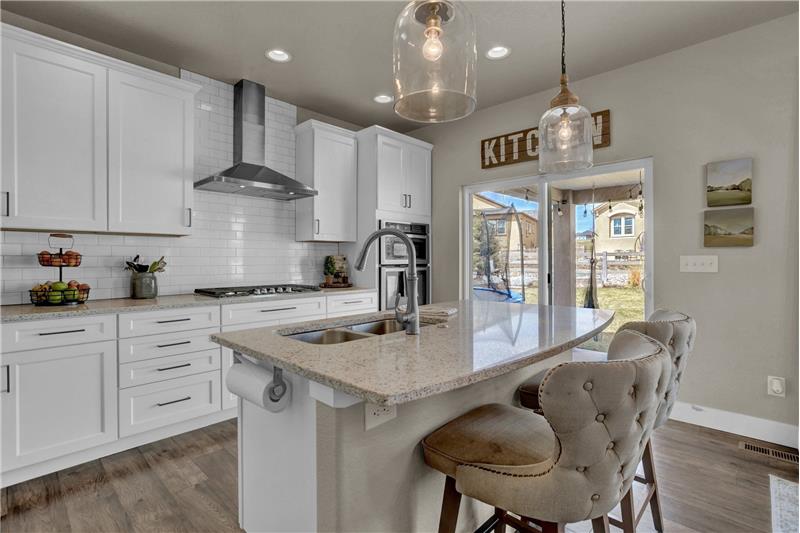 Gourmet Island Kitchen with Walk Out to Covered Patio