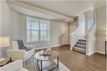 The Entry walks into the formal Living Room with front views and beautiful wood laminate flooring.