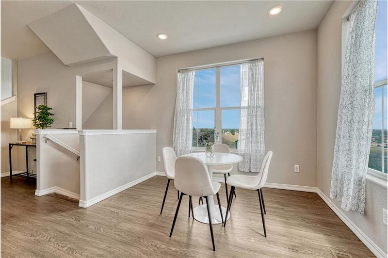 The dining room showcases fabulous views & provides easy access to the kitchen for effortless entertaining & cleanup.