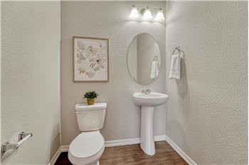 Convenient Powder Bathroom with pedestal sink.